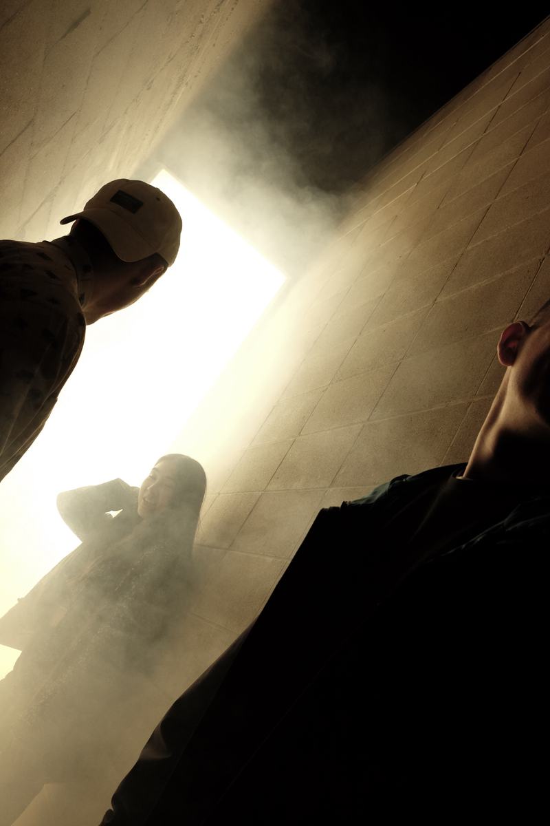 Visitors in haze and light
