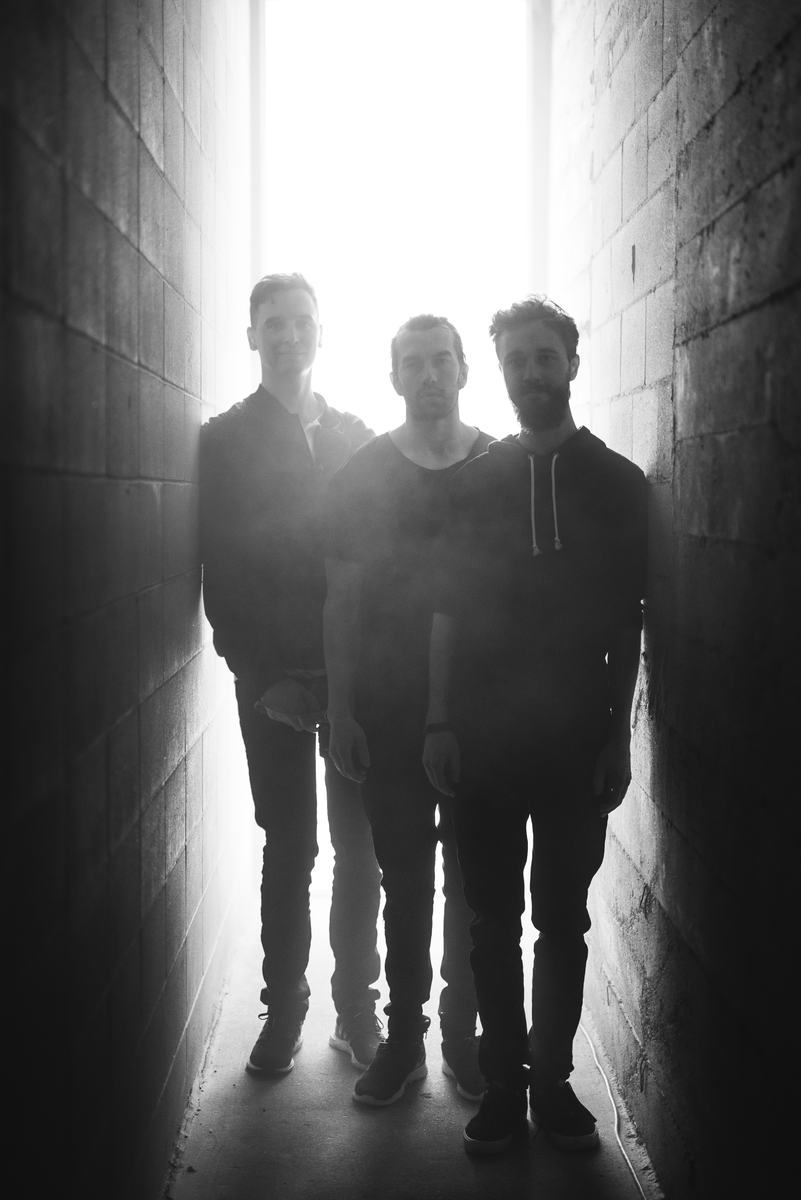 Three figures in the light
