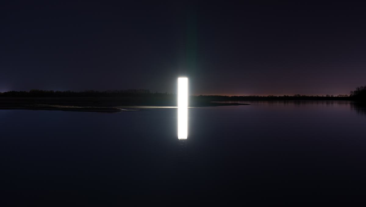 The wall of light standing in water at dusk